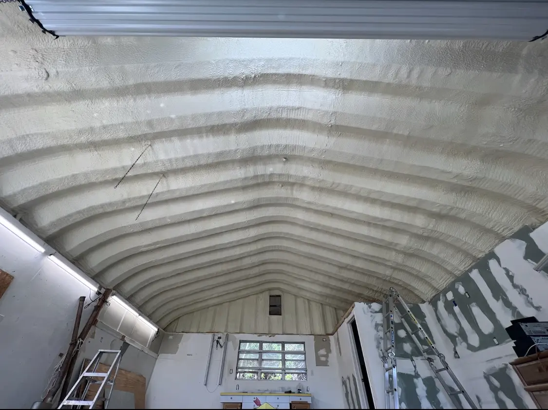 Spray polyurethane foam applied to the underside of a metal roof deck in Tremonton